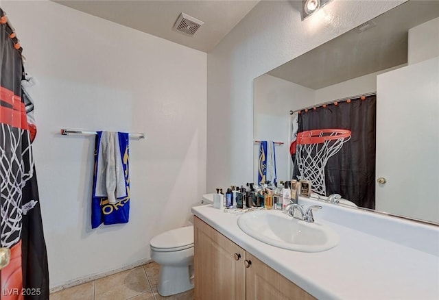 bathroom featuring tile patterned flooring, toilet, vanity, and a shower with curtain