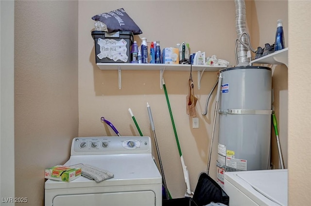 washroom featuring washer / dryer and water heater