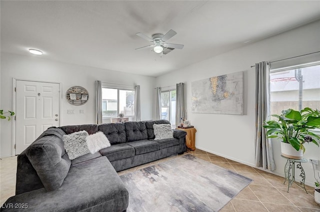 living room with light tile patterned floors and a ceiling fan