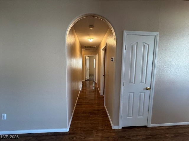 3136 Jane Austin Ave, North Las Vegas, NV 89031 - hallway with dark wood-style floors and arched walkways