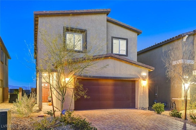 5236 Sunstone Mesa Dr, Las Vegas, NV 89166 - mediterranean / spanish home with stucco siding, decorative driveway, and a garage