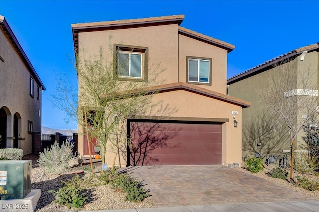 5236 Sunstone Mesa Dr, Las Vegas, NV 89166 - view of front of house with stucco siding, an attached garage, decorative driveway, and a tiled roof