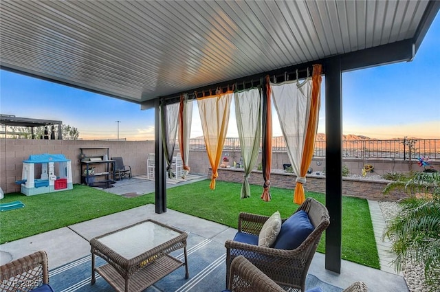 5236 Sunstone Mesa Dr, Las Vegas, NV 89166 - patio terrace at dusk with a patio area