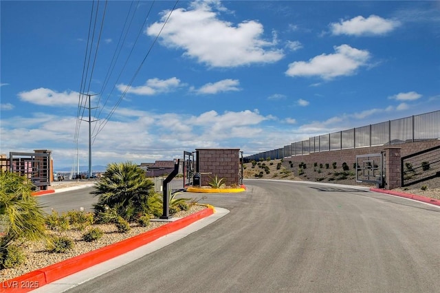 5236 Sunstone Mesa Dr, Las Vegas, NV 89166 - view of asphalt road featuring curbs