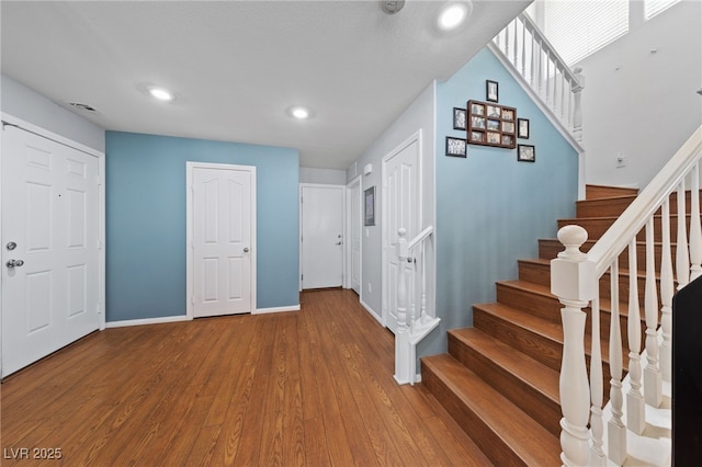 10440 Bay Ginger Ln, Las Vegas, NV 89135 - foyer entrance featuring baseboards, stairway, wood finished floors, and recessed lighting