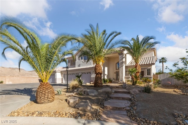 6999 Stone Meadows Ave, Las Vegas, NV 89142 - view of front facade with stucco siding, driveway, a garage, and a tile roof