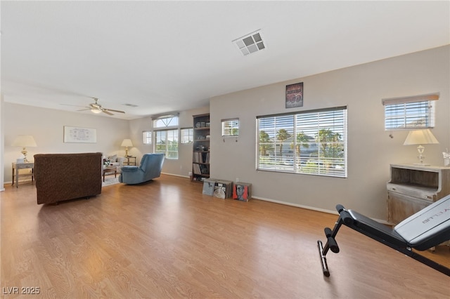6999 Stone Meadows Ave, Las Vegas, NV 89142 - living area with light wood-type flooring, a ceiling fan, and baseboards