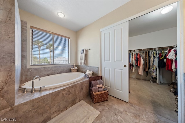 6999 Stone Meadows Ave, Las Vegas, NV 89142 - full bathroom featuring a garden tub and a spacious closet