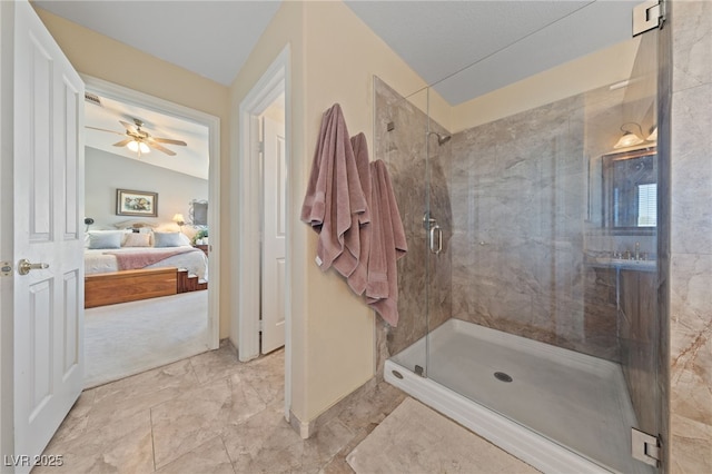 6999 Stone Meadows Ave, Las Vegas, NV 89142 - full bathroom featuring connected bathroom, a shower stall, a ceiling fan, and baseboards
