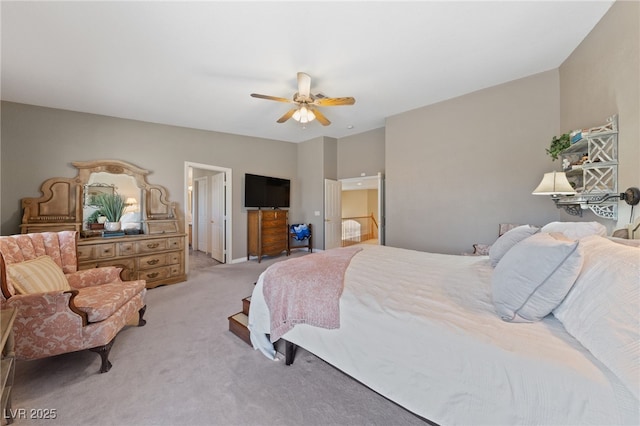 6999 Stone Meadows Ave, Las Vegas, NV 89142 - bedroom featuring light carpet, ensuite bath, and a ceiling fan