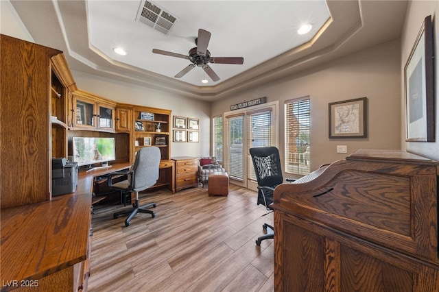 6999 Stone Meadows Ave, Las Vegas, NV 89142 - office area with a tray ceiling, ceiling fan, recessed lighting, and wood finished floors