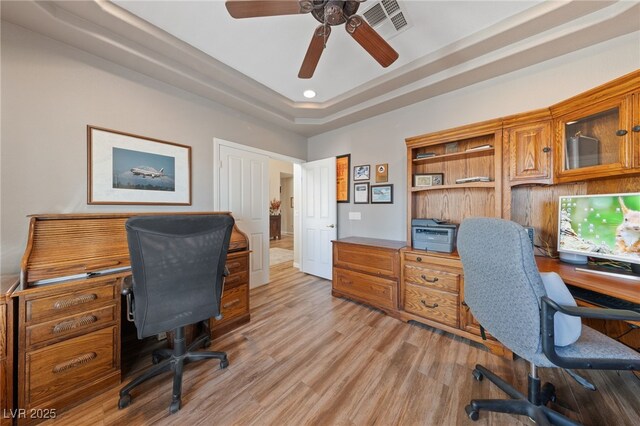 6999 Stone Meadows Ave, Las Vegas, NV 89142 - office space with light wood-style floors, a ceiling fan, a tray ceiling, and recessed lighting