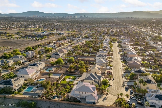 6999 Stone Meadows Ave, Las Vegas, NV 89142 - aerial view of property's location featuring a mountain backdrop and nearby suburban area