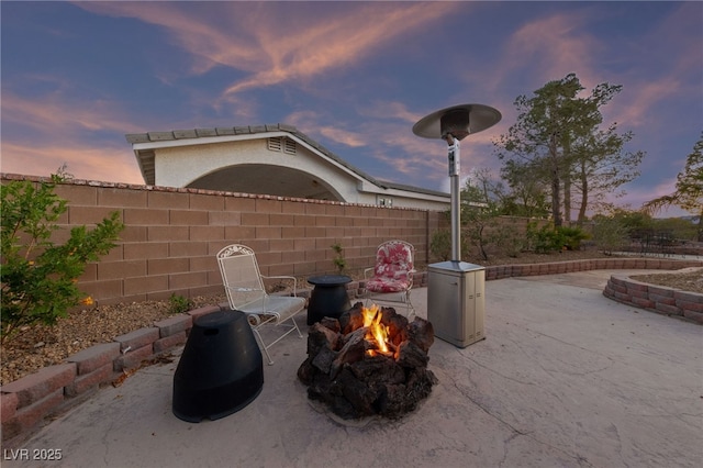 6999 Stone Meadows Ave, Las Vegas, NV 89142 - view of patio featuring a fire pit
