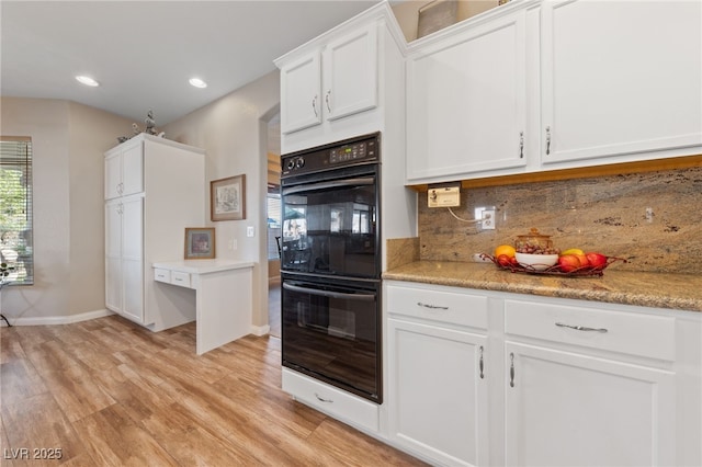 6999 Stone Meadows Ave, Las Vegas, NV 89142 - kitchen with light wood finished floors, backsplash, white cabinetry, recessed lighting, and light countertops