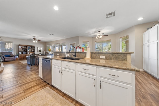 6999 Stone Meadows Ave, Las Vegas, NV 89142 - kitchen with dishwasher, a sink, ceiling fan, open floor plan, and recessed lighting