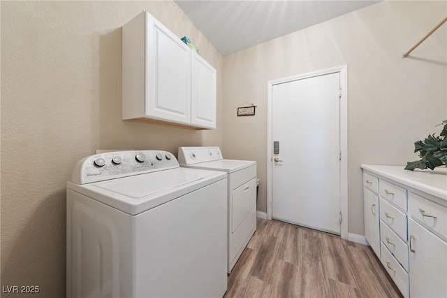 6999 Stone Meadows Ave, Las Vegas, NV 89142 - washroom featuring independent washer and dryer, light wood finished floors, cabinet space, and baseboards