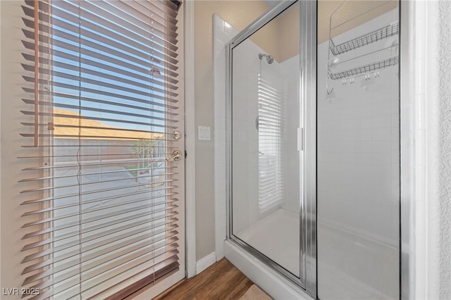 6999 Stone Meadows Ave, Las Vegas, NV 89142 - full bathroom featuring wood finished floors, a shower stall, and baseboards