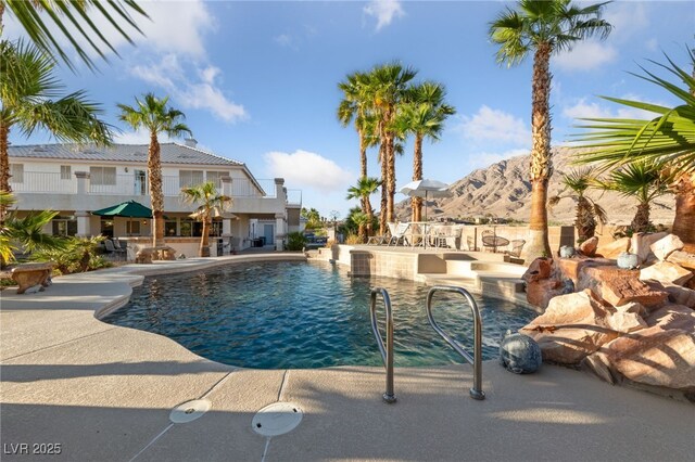 6999 Stone Meadows Ave, Las Vegas, NV 89142 - outdoor pool featuring a mountain view and a patio