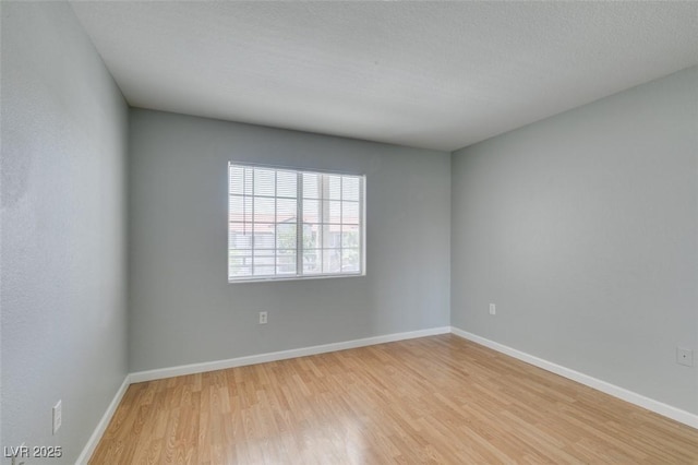 3318 N Decatur Blvd Unit 2110, Las Vegas, NV 89130 - unfurnished room featuring light wood-type flooring and baseboards