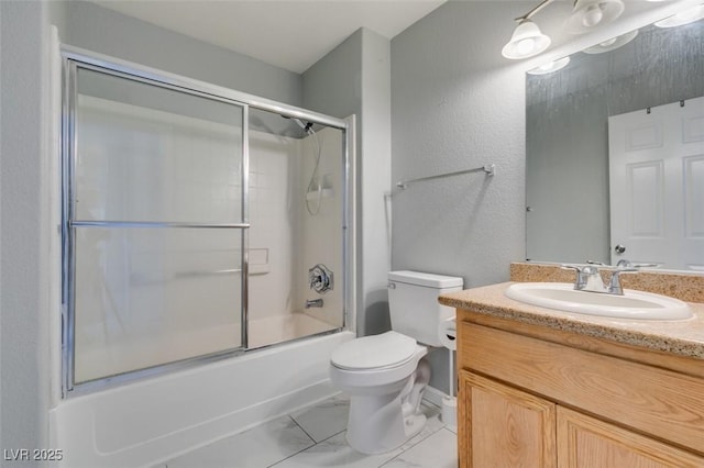 3318 N Decatur Blvd Unit 2110, Las Vegas, NV 89130 - full bathroom with vanity, toilet, marble look tiles, and shower / bath combination with glass door