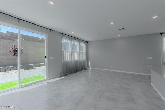 4589 Swimming Minnow Ave, Las Vegas, NV 89141 - unfurnished room with healthy amount of natural light, baseboards, recessed lighting, and light tile patterned flooring