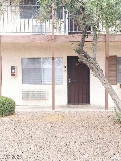 4955 Jeffreys St Unit 403, Las Vegas, NV 89119 - doorway to property with a balcony and stucco siding