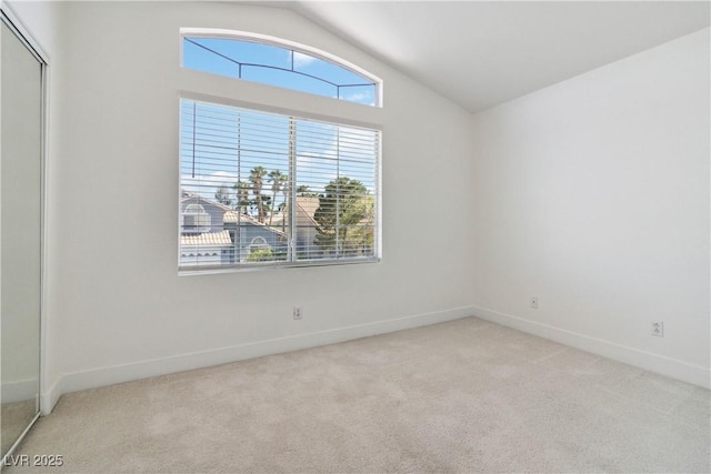 8714 Las Posas Ave, Las Vegas, NV 89147 - carpeted empty room with lofted ceiling and baseboards