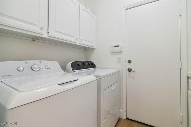 8714 Las Posas Ave, Las Vegas, NV 89147 - washroom featuring washing machine and dryer, cabinet space, and light wood-style floors