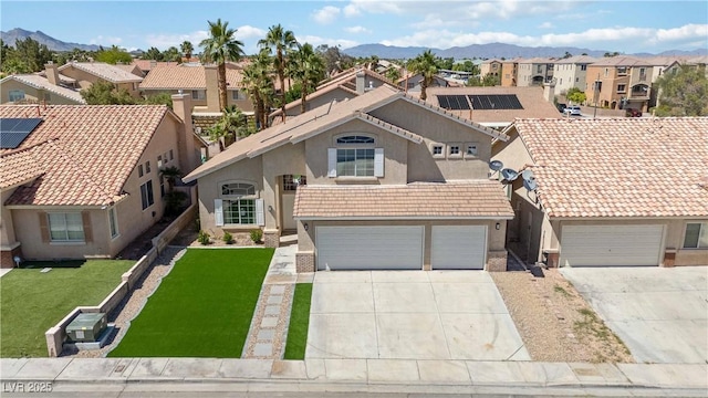 8714 Las Posas Ave, Las Vegas, NV 89147 - view of front of property featuring a residential view, stucco siding, driveway, a mountain view, and a front yard