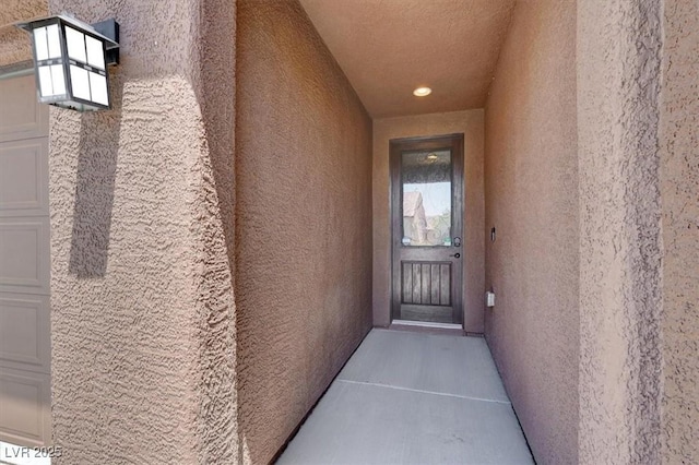 7428 Alamo Ranch Ave, Las Vegas, NV 89179 - doorway to property featuring stucco siding