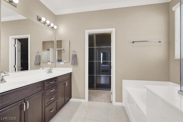 7428 Alamo Ranch Ave, Las Vegas, NV 89179 - full bathroom with a garden tub, baseboards, tile patterned flooring, double vanity, and crown molding