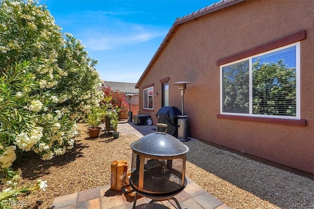 7428 Alamo Ranch Ave, Las Vegas, NV 89179 - view of side of property featuring a patio and stucco siding