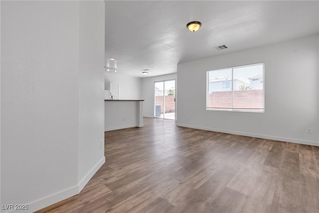 4149 Dignified Ct, North Las Vegas, NV 89032 - unfurnished living room with wood finished floors and baseboards