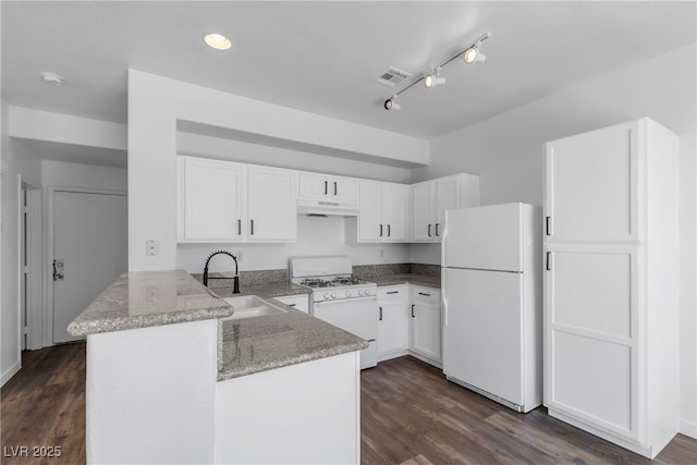 4149 Dignified Ct, North Las Vegas, NV 89032 - kitchen with white appliances, a sink, a peninsula, light stone counters, and white cabinetry