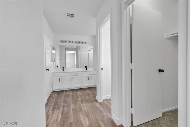 4149 Dignified Ct, North Las Vegas, NV 89032 - hall featuring a sink, baseboards, and wood finished floors