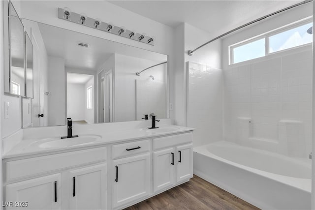4149 Dignified Ct, North Las Vegas, NV 89032 - full bathroom with tub / shower combination, double vanity, and wood finished floors