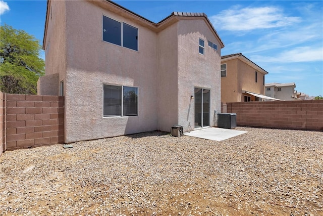 4149 Dignified Ct, North Las Vegas, NV 89032 - back of house featuring stucco siding, fence, and cooling unit