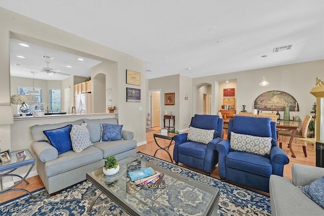 5068 Rivedro St, Las Vegas, NV 89135 - living area featuring arched walkways, light wood-style floors, recessed lighting, baseboards, and ceiling fan