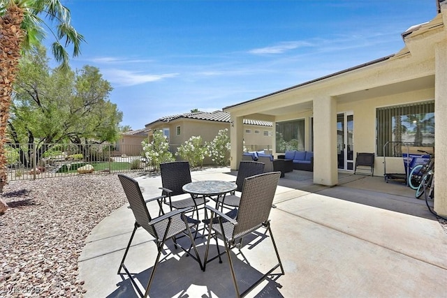 5068 Rivedro St, Las Vegas, NV 89135 - view of patio featuring an outdoor living space, fence, and outdoor dining space