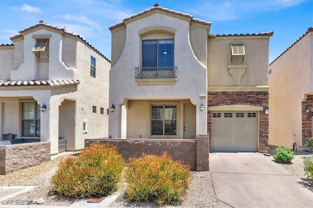10230 Viterbo St, Las Vegas, NV 89183 - mediterranean / spanish-style home featuring an attached garage, stucco siding, driveway, stone siding, and a tile roof