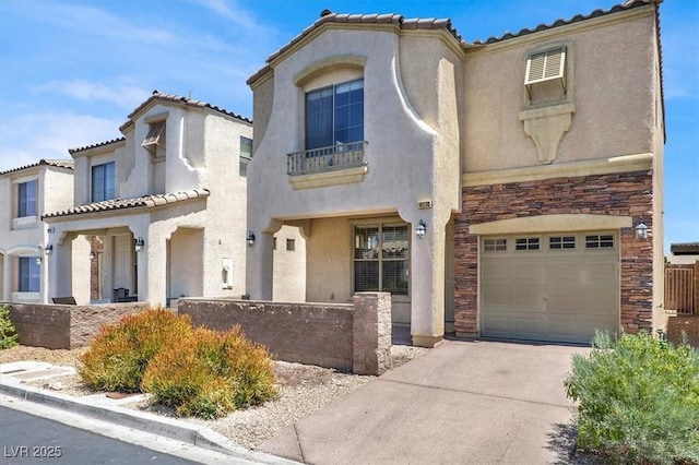 10230 Viterbo St, Las Vegas, NV 89183 - mediterranean / spanish house with stone siding, a garage, stucco siding, concrete driveway, and a tile roof