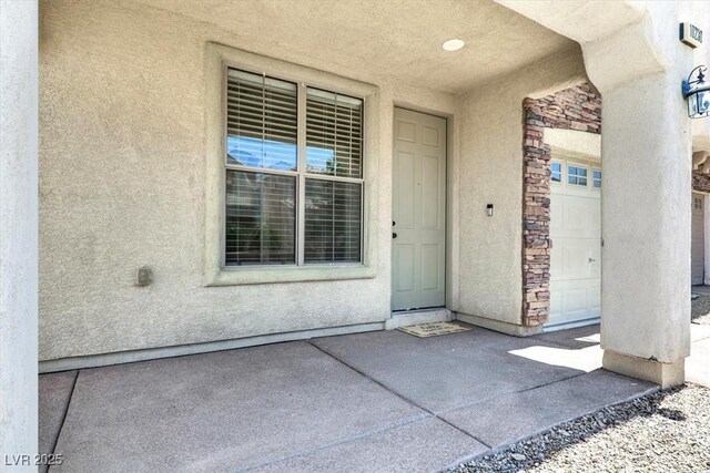 10230 Viterbo St, Las Vegas, NV 89183 - view of exterior entry with stone siding and stucco siding