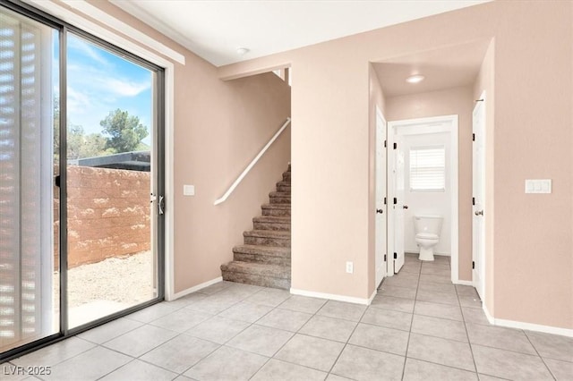 10230 Viterbo St, Las Vegas, NV 89183 - unfurnished room featuring light tile patterned flooring, stairs, and baseboards