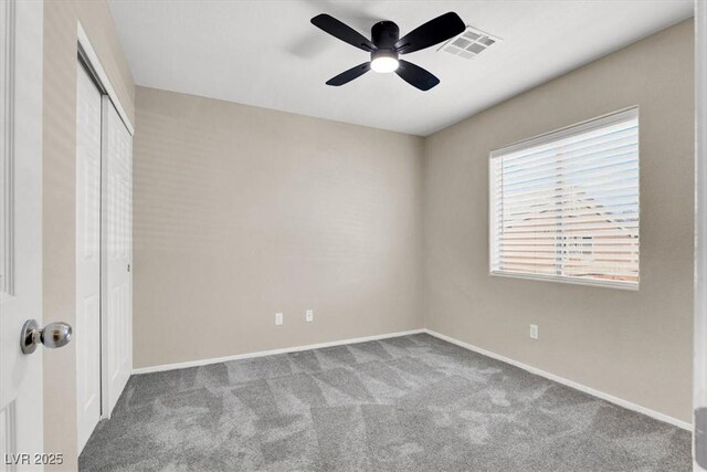 10230 Viterbo St, Las Vegas, NV 89183 - unfurnished bedroom featuring carpet floors, a closet, baseboards, and a ceiling fan