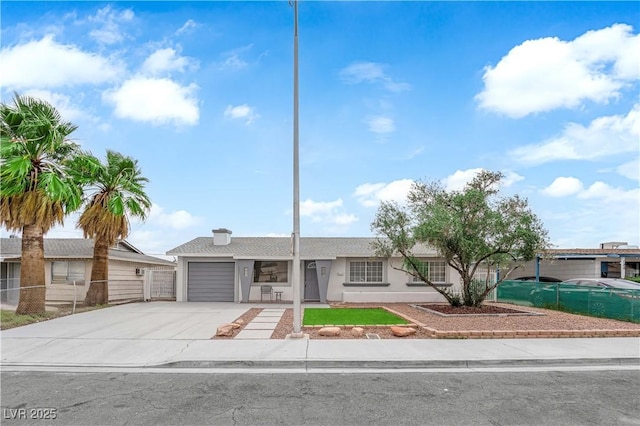 721 Carpenter Dr, Las Vegas, NV 89107 - single story home with concrete driveway, an attached garage, fence, and stucco siding