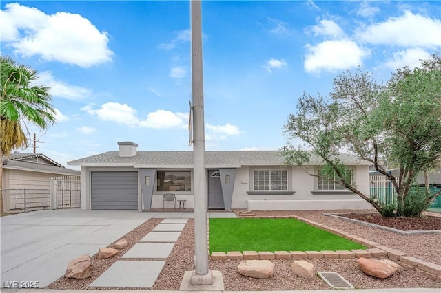 721 Carpenter Dr, Las Vegas, NV 89107 - single story home with stucco siding, concrete driveway, an attached garage, and a shingled roof