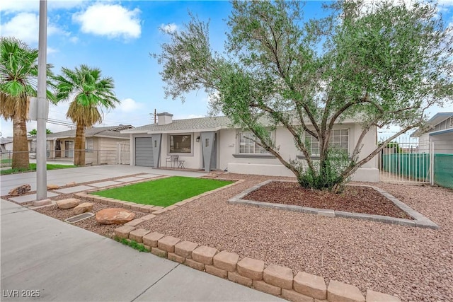 721 Carpenter Dr, Las Vegas, NV 89107 - single story home featuring concrete driveway, fence, a garage, and stucco siding