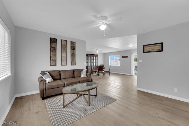 721 Carpenter Dr, Las Vegas, NV 89107 - living room featuring a ceiling fan, light wood-type flooring, and baseboards