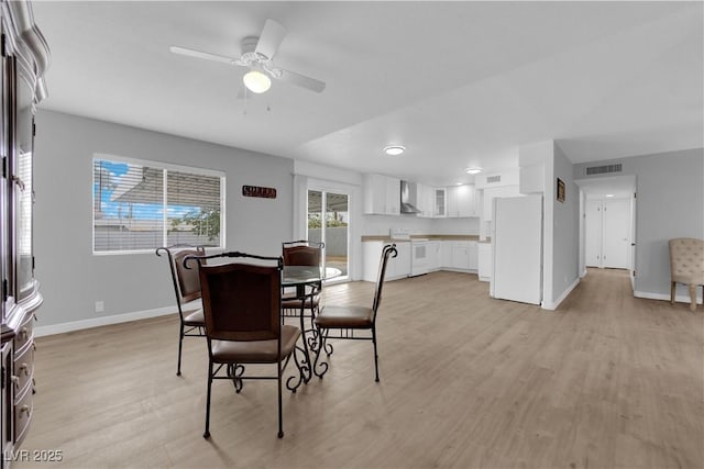 721 Carpenter Dr, Las Vegas, NV 89107 - dining space featuring baseboards, light wood-type flooring, and ceiling fan